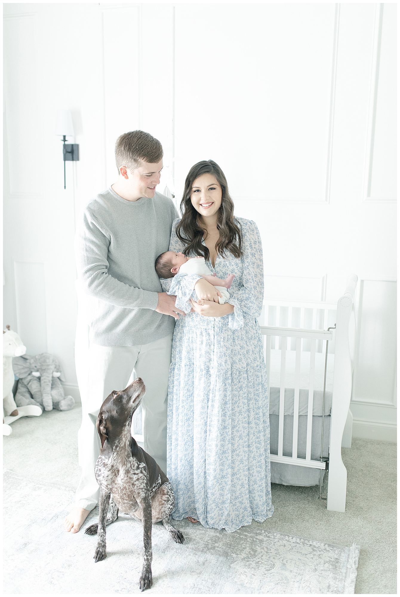 Family photo with their pet. Photo by Little Sunshine Photography.