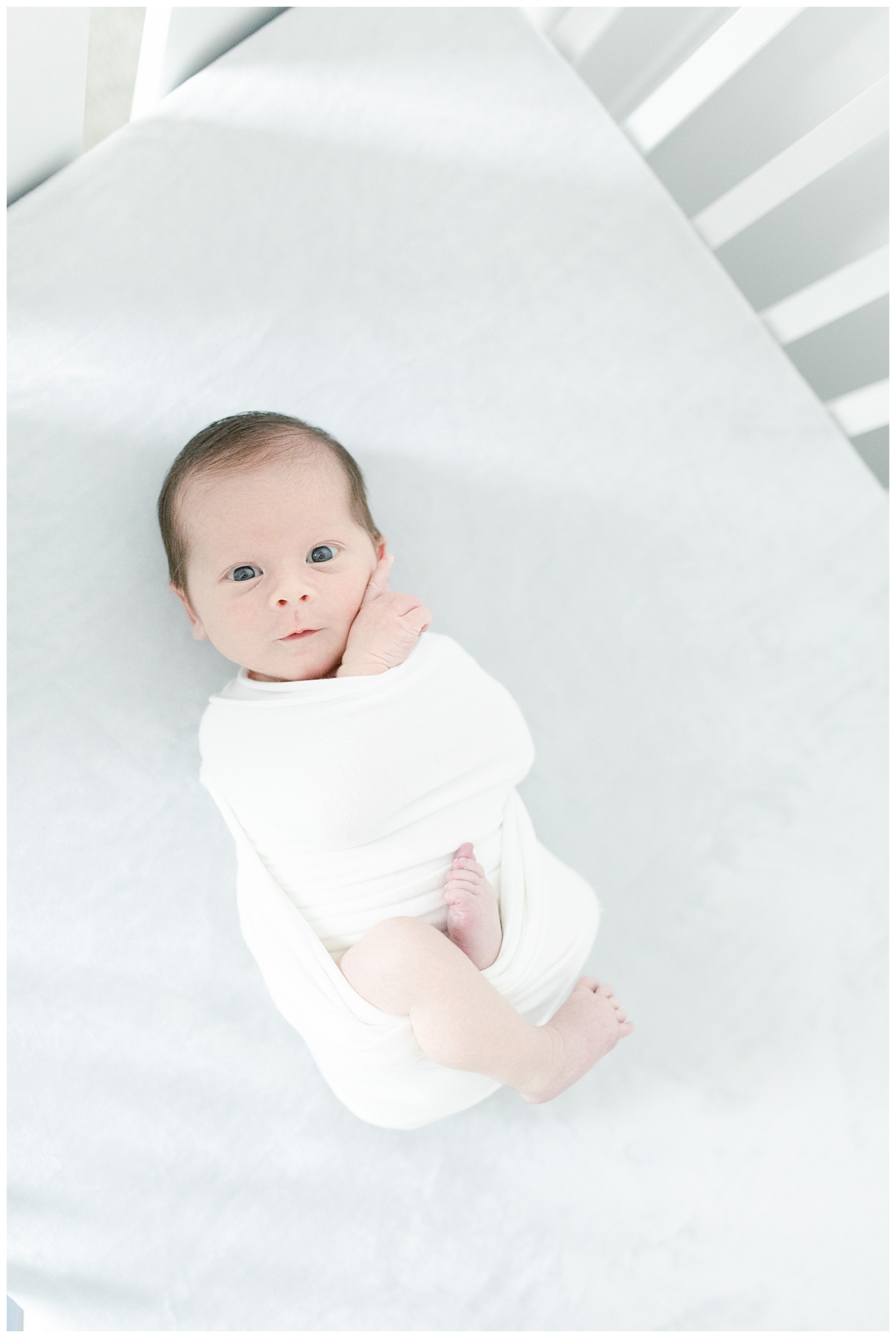 Alert newborn photographed during in home newborn session. Photo by Little Sunshine Photography.