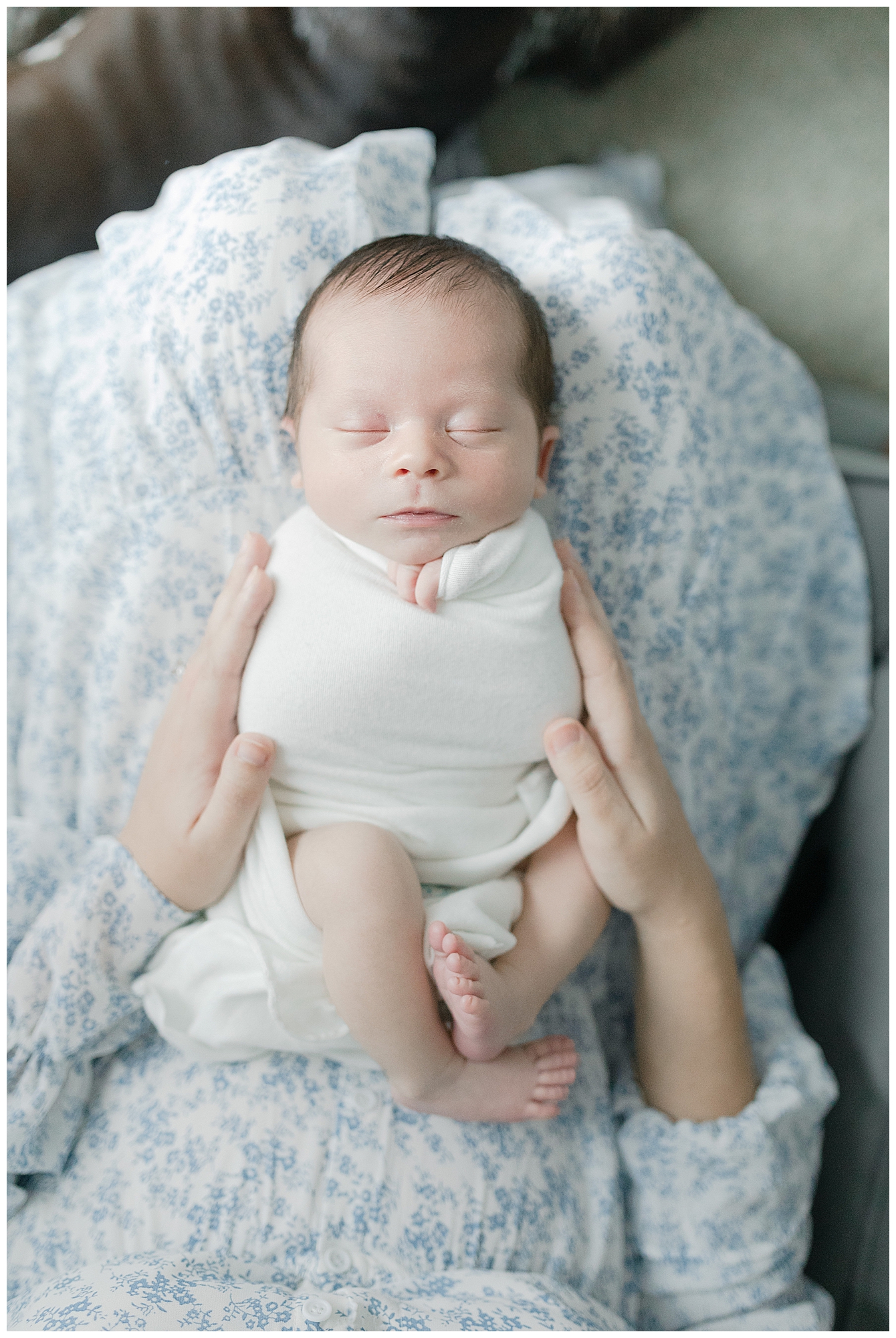 Lifestyle in home MS Gulf newborn session. Photo by Little Sunshine Photography.