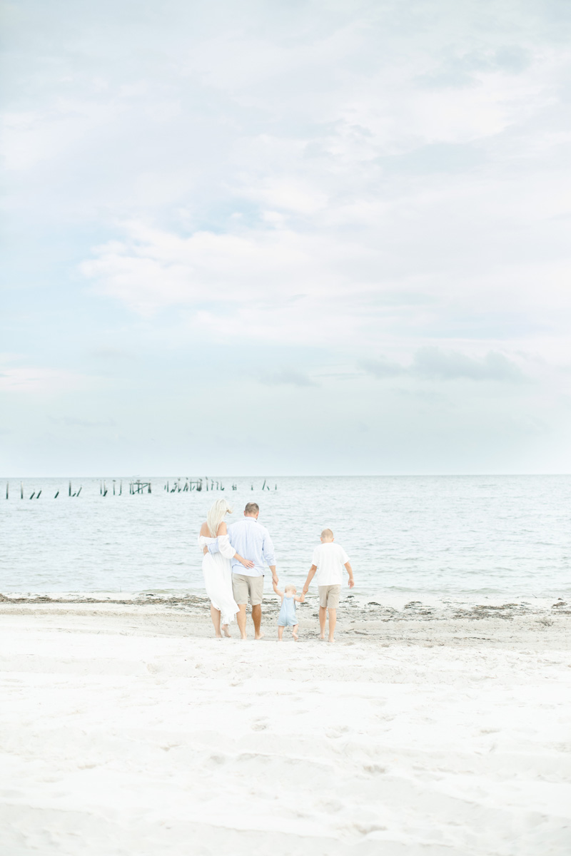 family walking on beach MS Gulf Coast