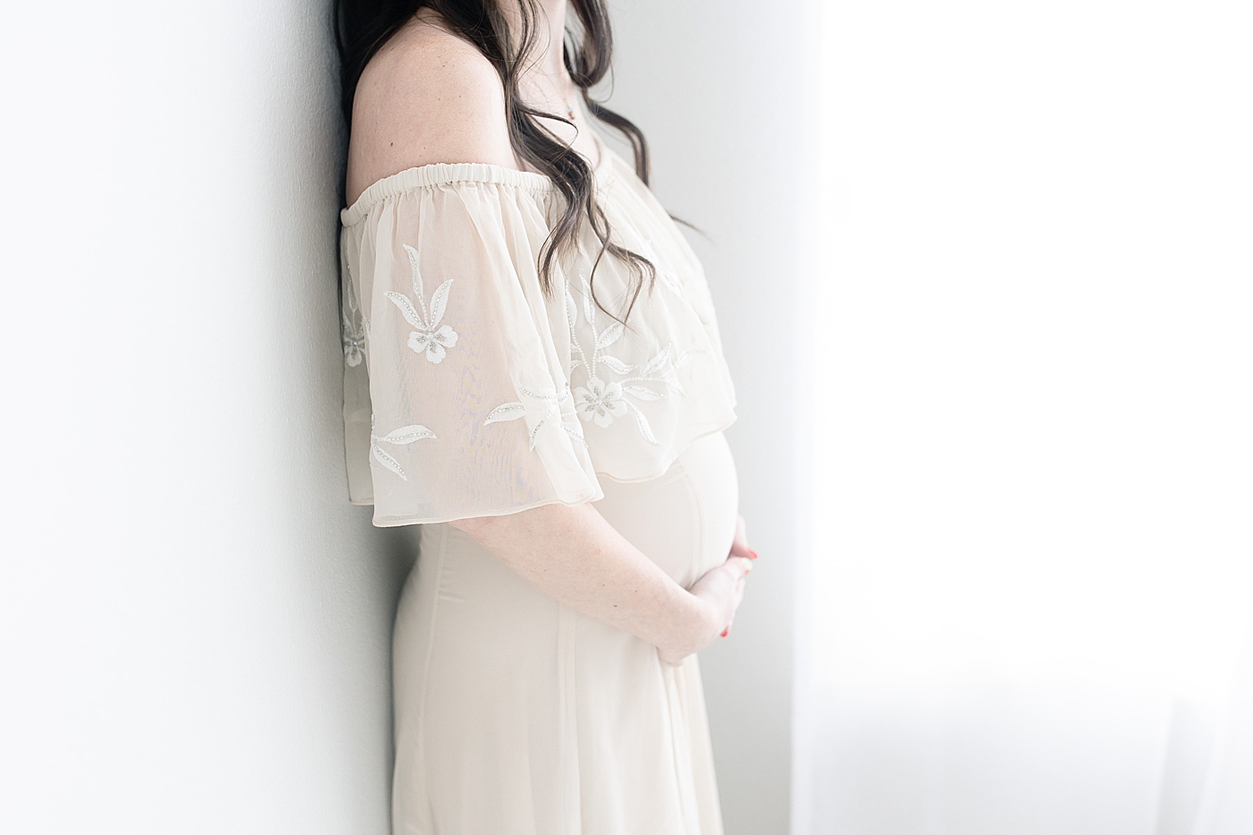 Pregnant mom wearing beautiful dress for maternity photos. Photo by Little Sunshine Photography.