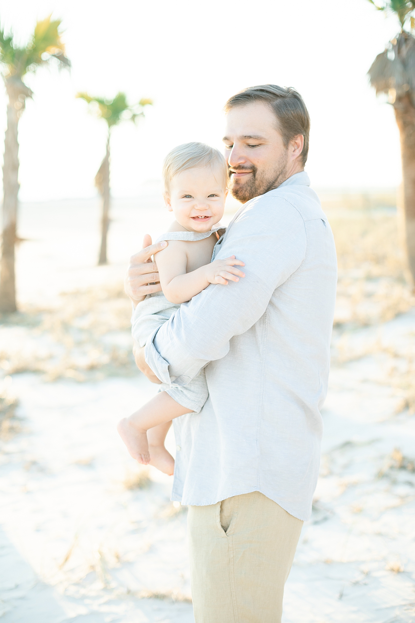 Father-son photo on the beach Photo by Little Sunshine Photography.