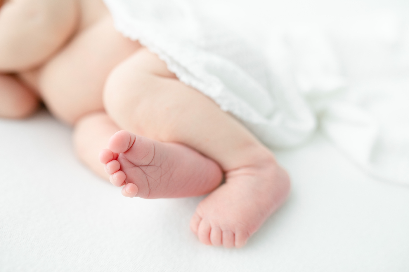 Detail portrait of baby's toes during newborn session with Little Sunshine Photography.