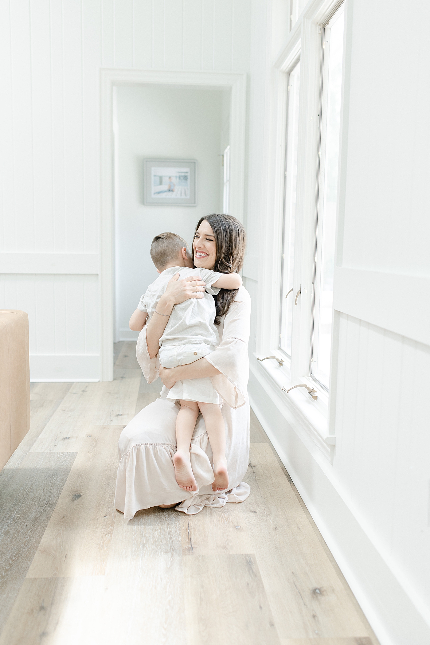 Mom hugging her son during in-home session. Photo by Little Sunshine Photography