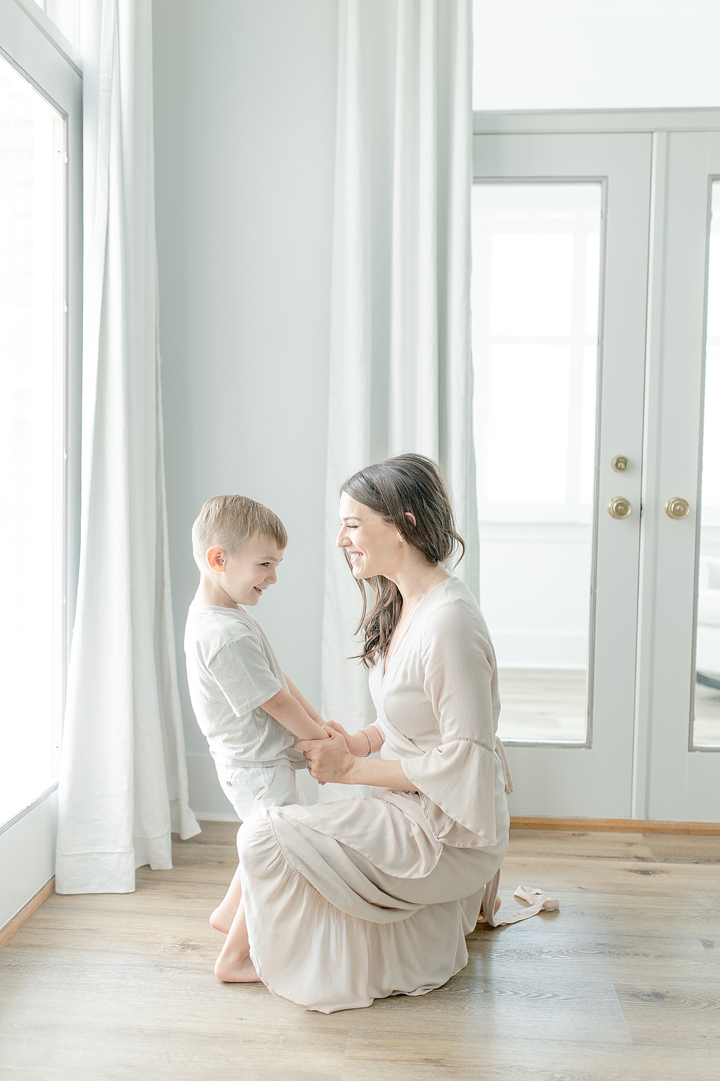 Photo of Mom with her son in master bedroom. Photo by Little Sunshine Photography