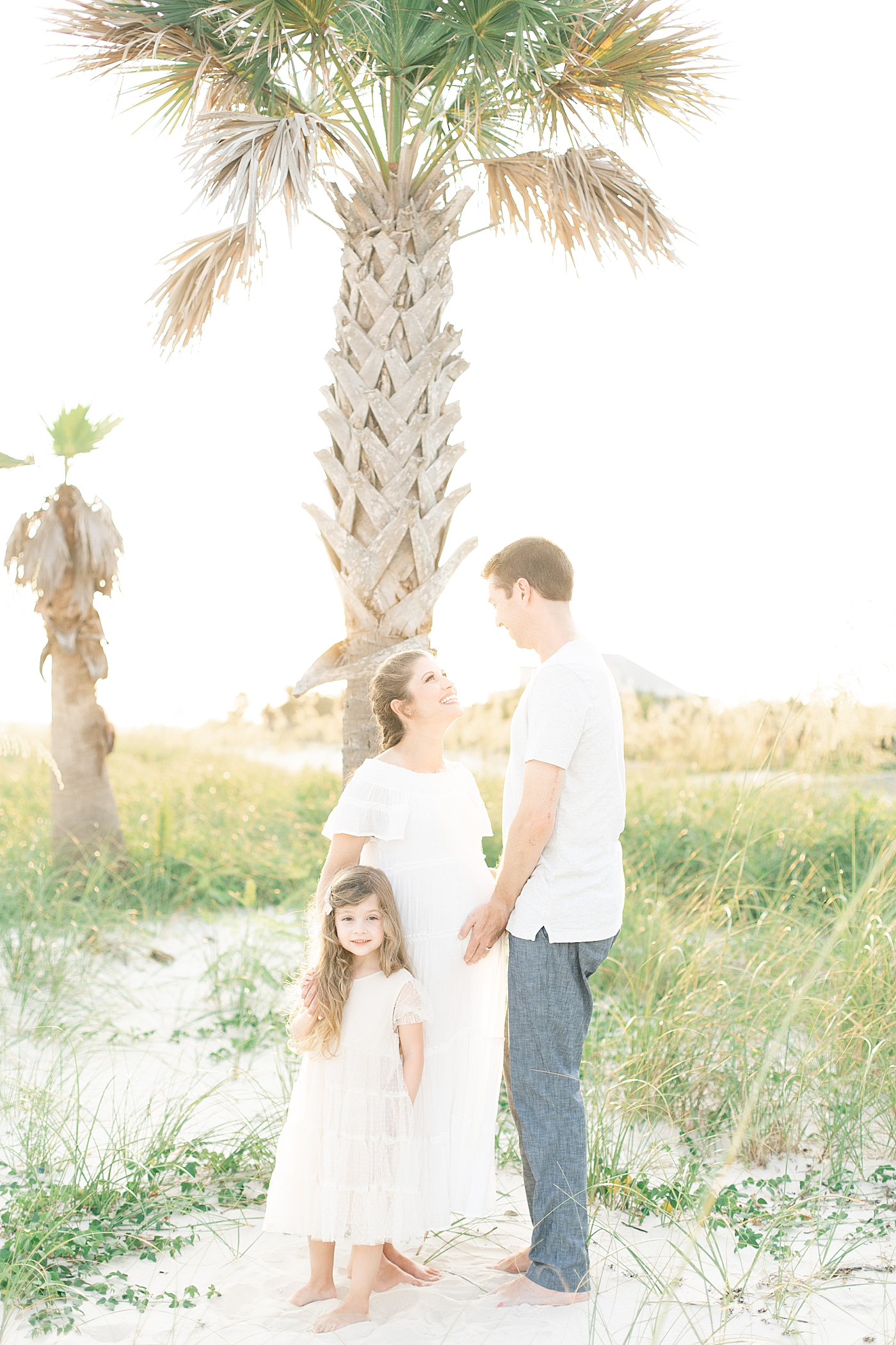 Family of three at ocean springs. Photo by Little Sunshine Photography.