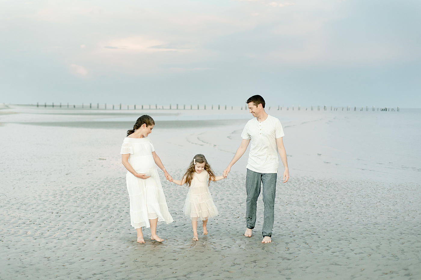 Sunset during family session on the beach. Photo by Little Sunshine Photography.