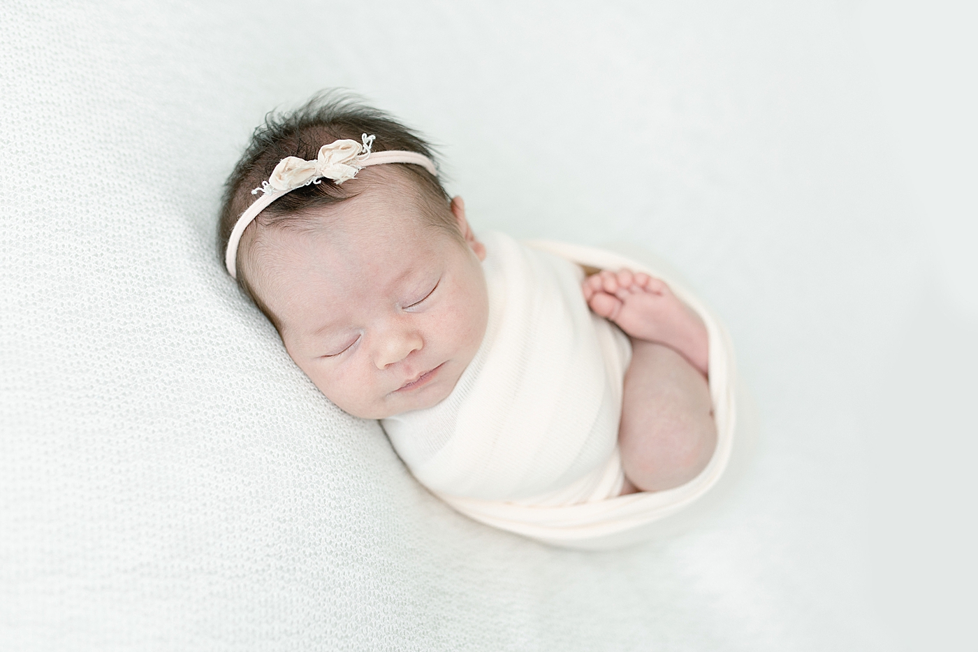 Baby girl swaddled for newborn session. Photo by Little Sunshine Photography