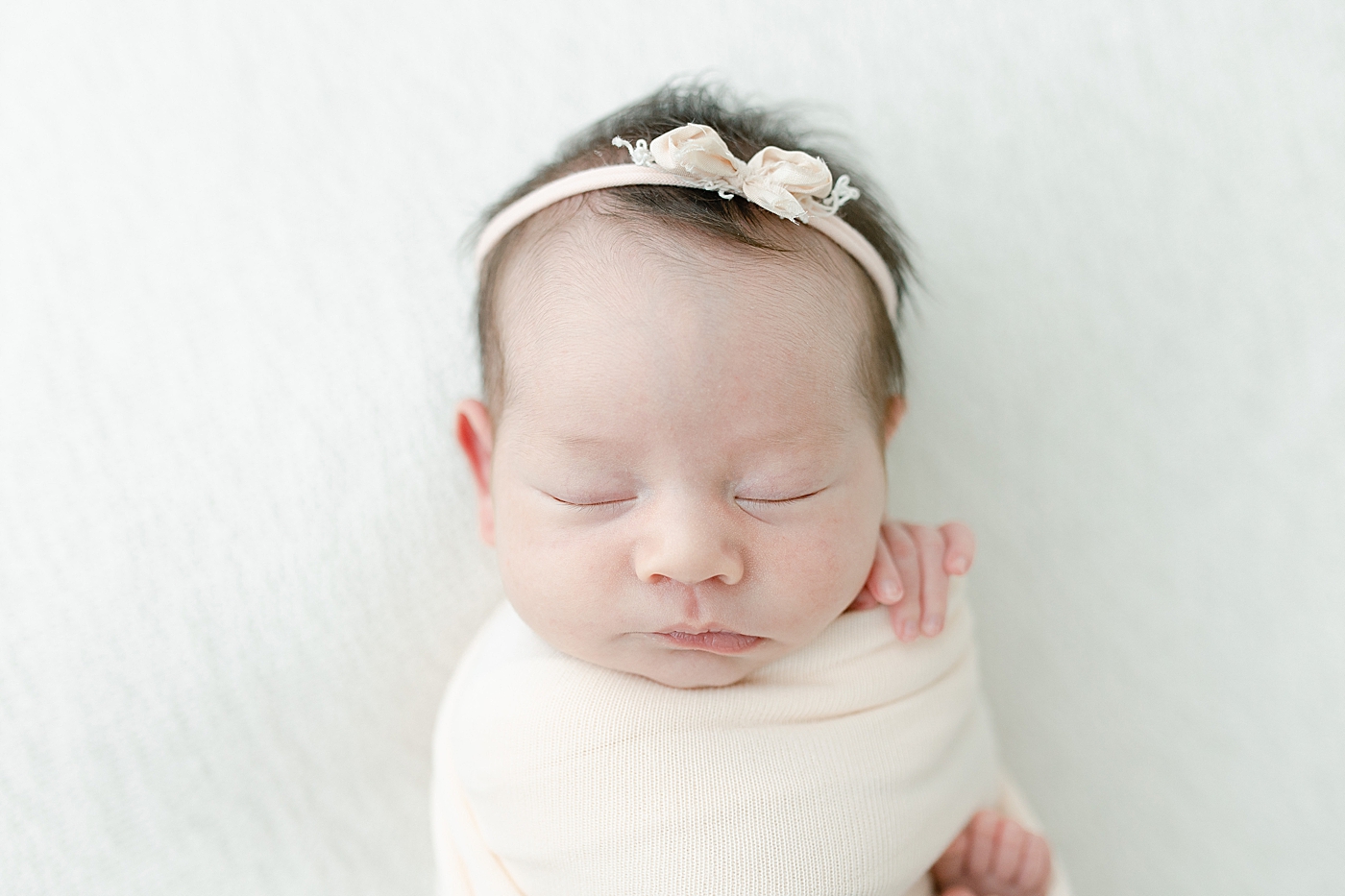 Baby girl swaddled for newborn session. Photo by Little Sunshine Photography