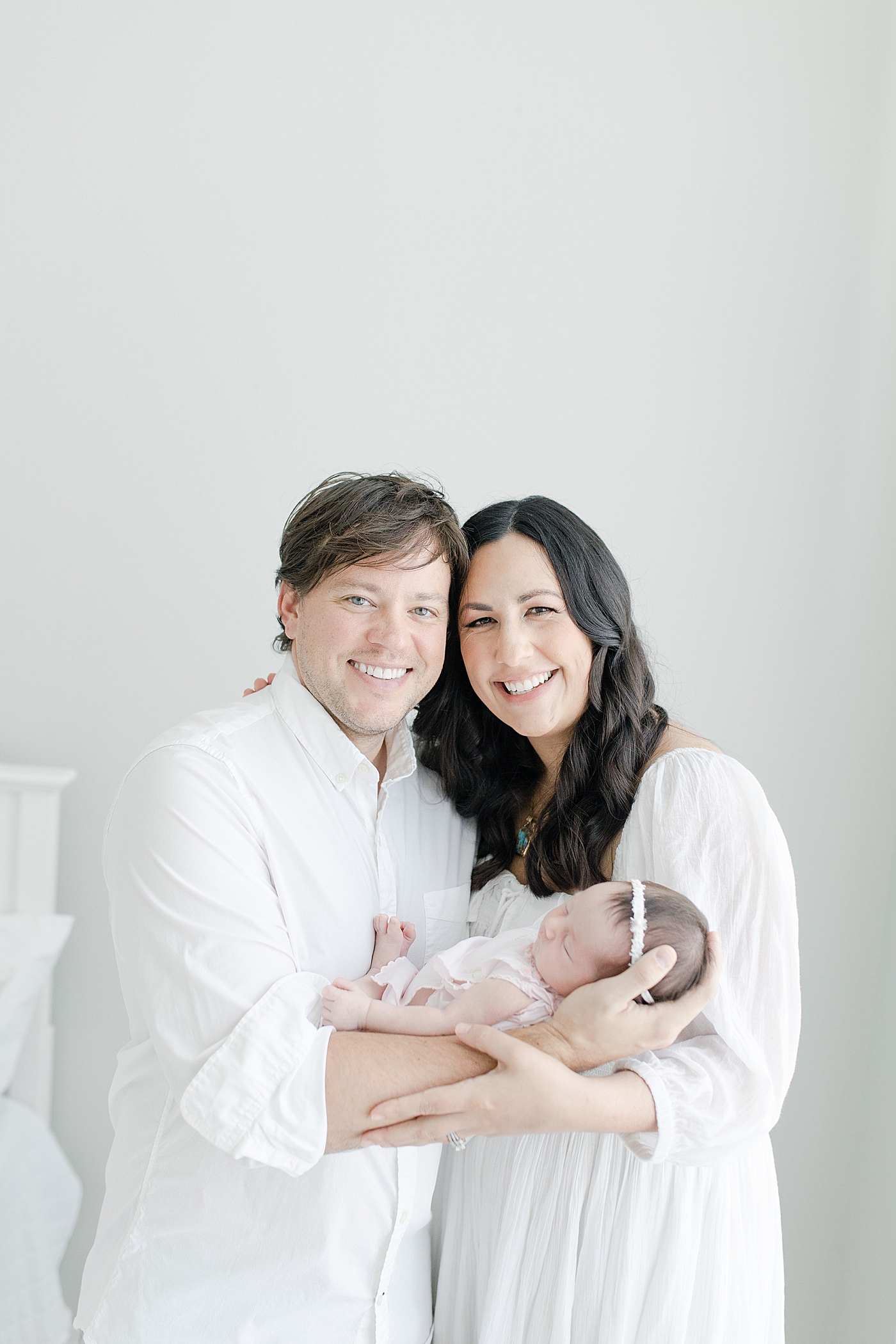 First family portrait of Mom, Dad and their newborn daughter. Photo by Little Sunshine Photography