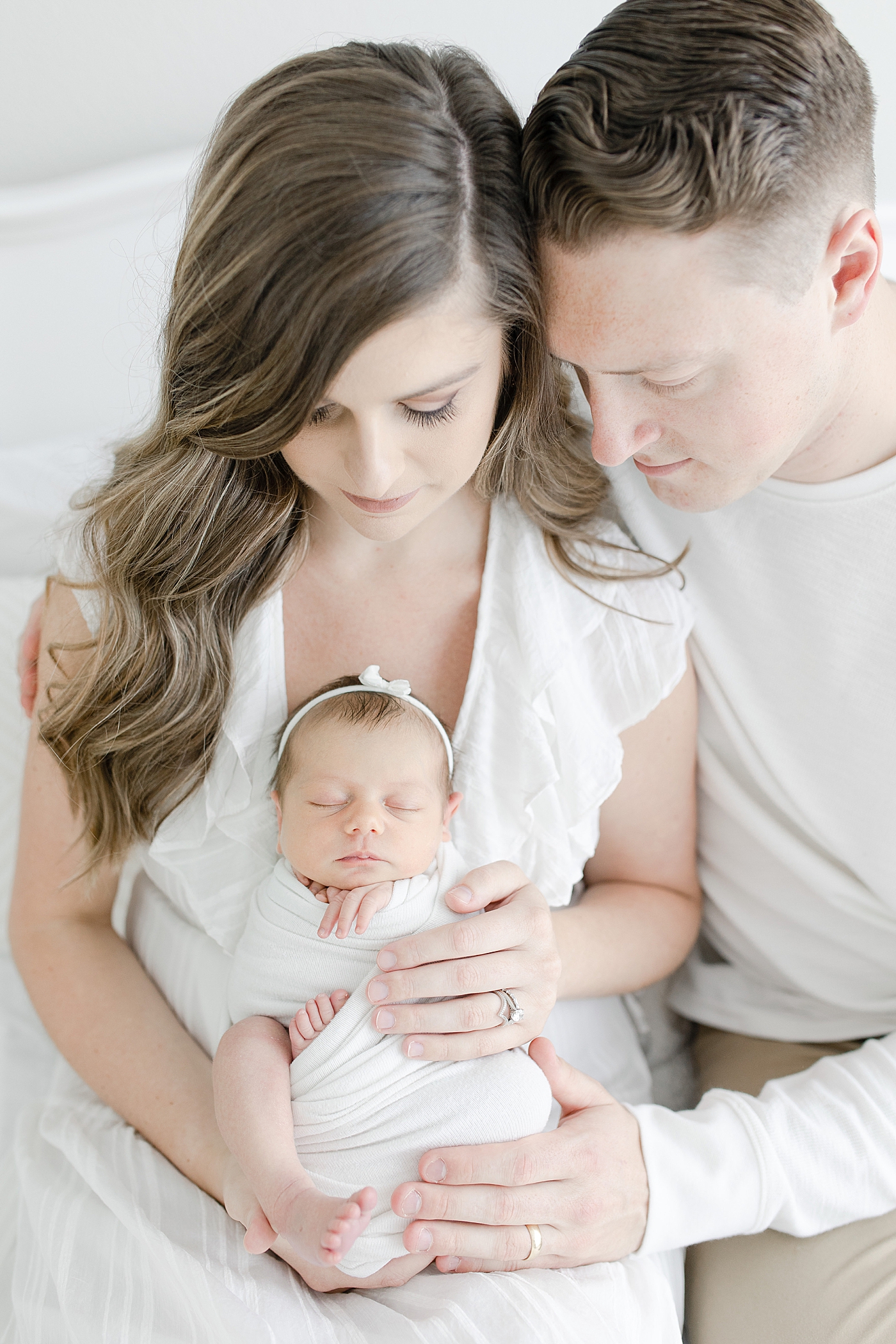 Newborn with parents for studio session | Photo by Little Sunshine Photography.