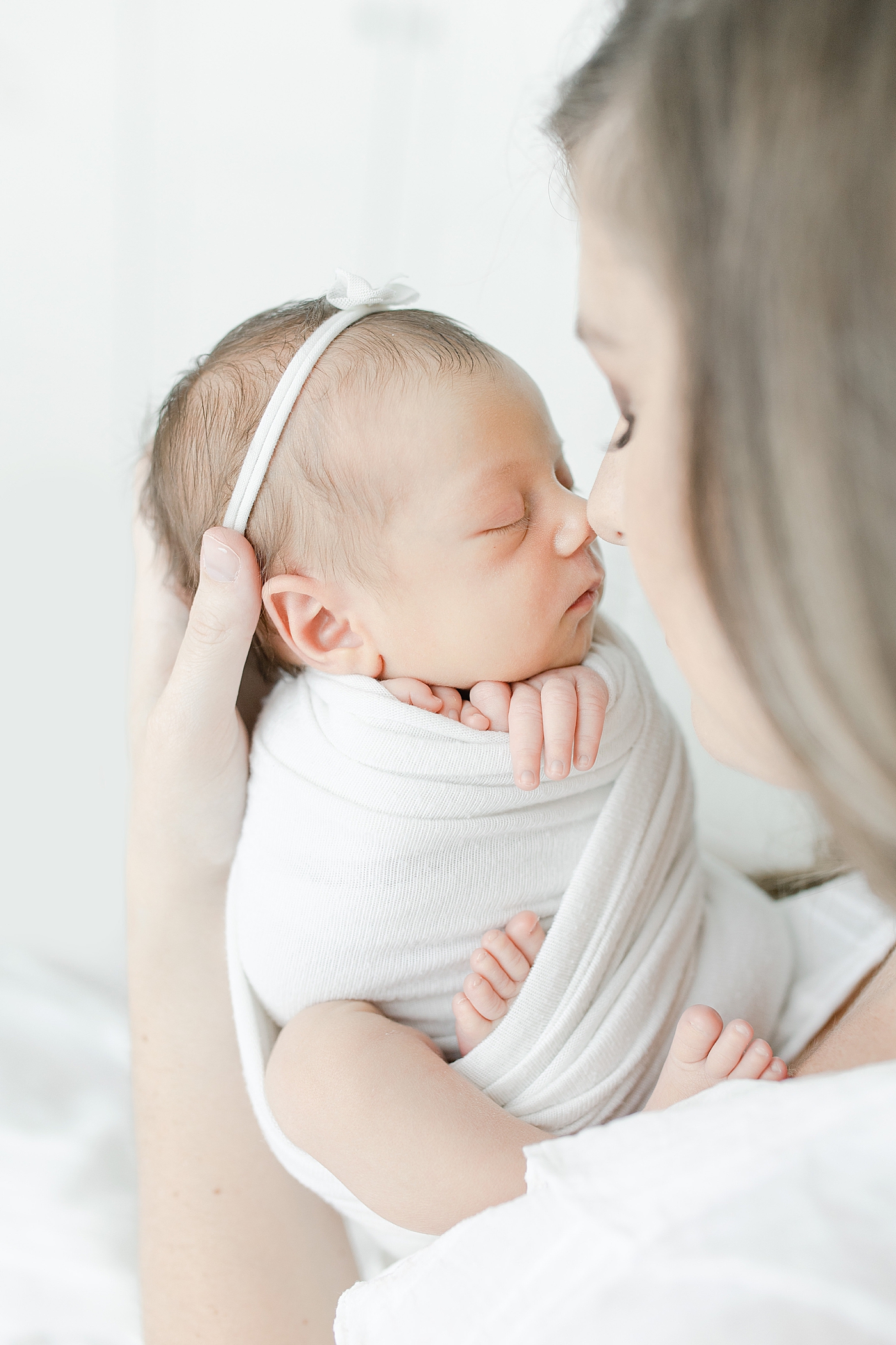 Mom nose to nose with her baby girl | Photo by Hattiesburg newborn photographer, Little Sunshine Photography.