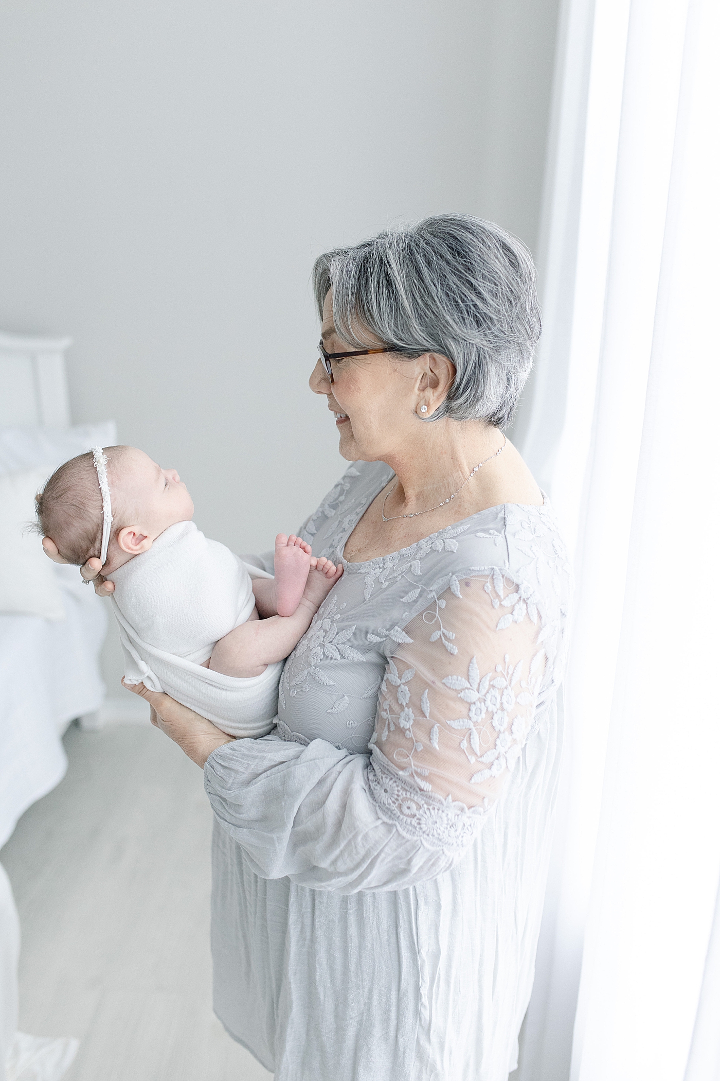 Grandma holding baby girl | Bay St. Louis newborn photographer Little Sunshine Photography