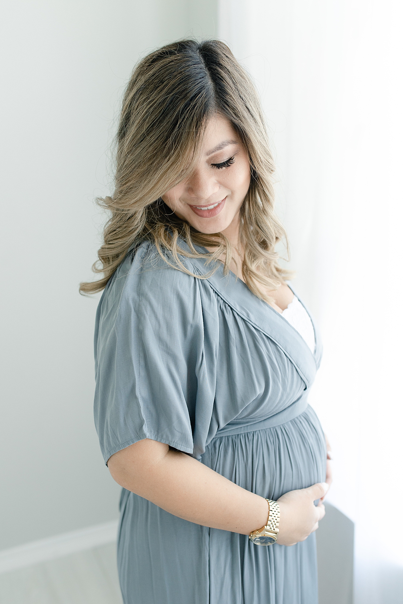 Mama to be in slate blue dress | Photo by Gulfport MS maternity photographer Little Sunshine Photography 
