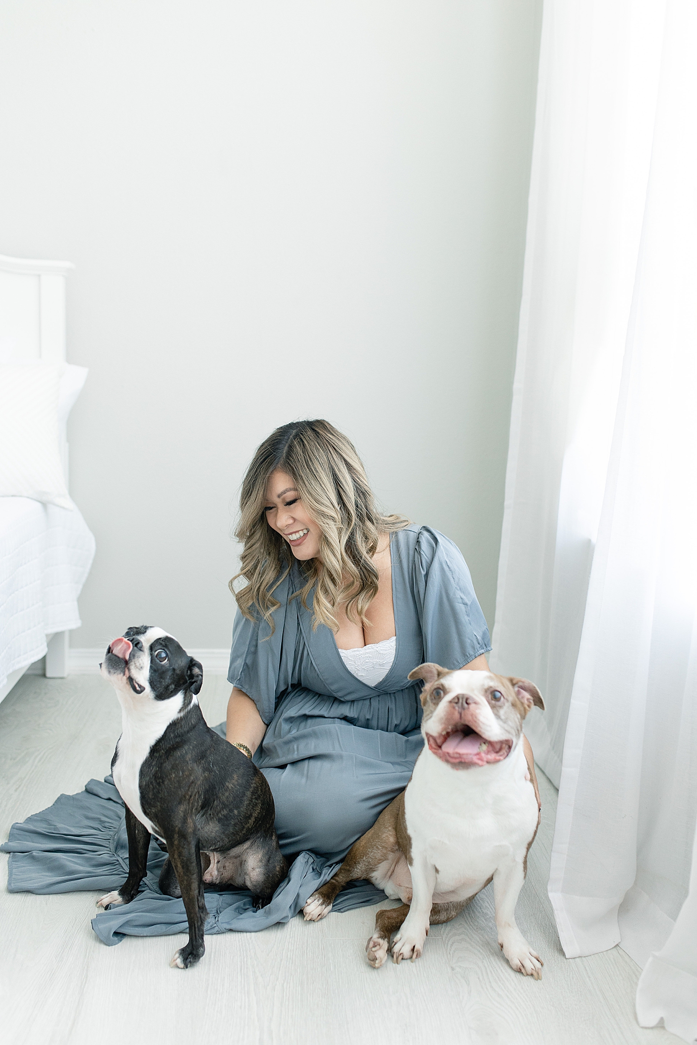 Mama to be in blue dress with her two dogs | Photo by MS Gulf Coast Photographer Little Sunshine Photography 