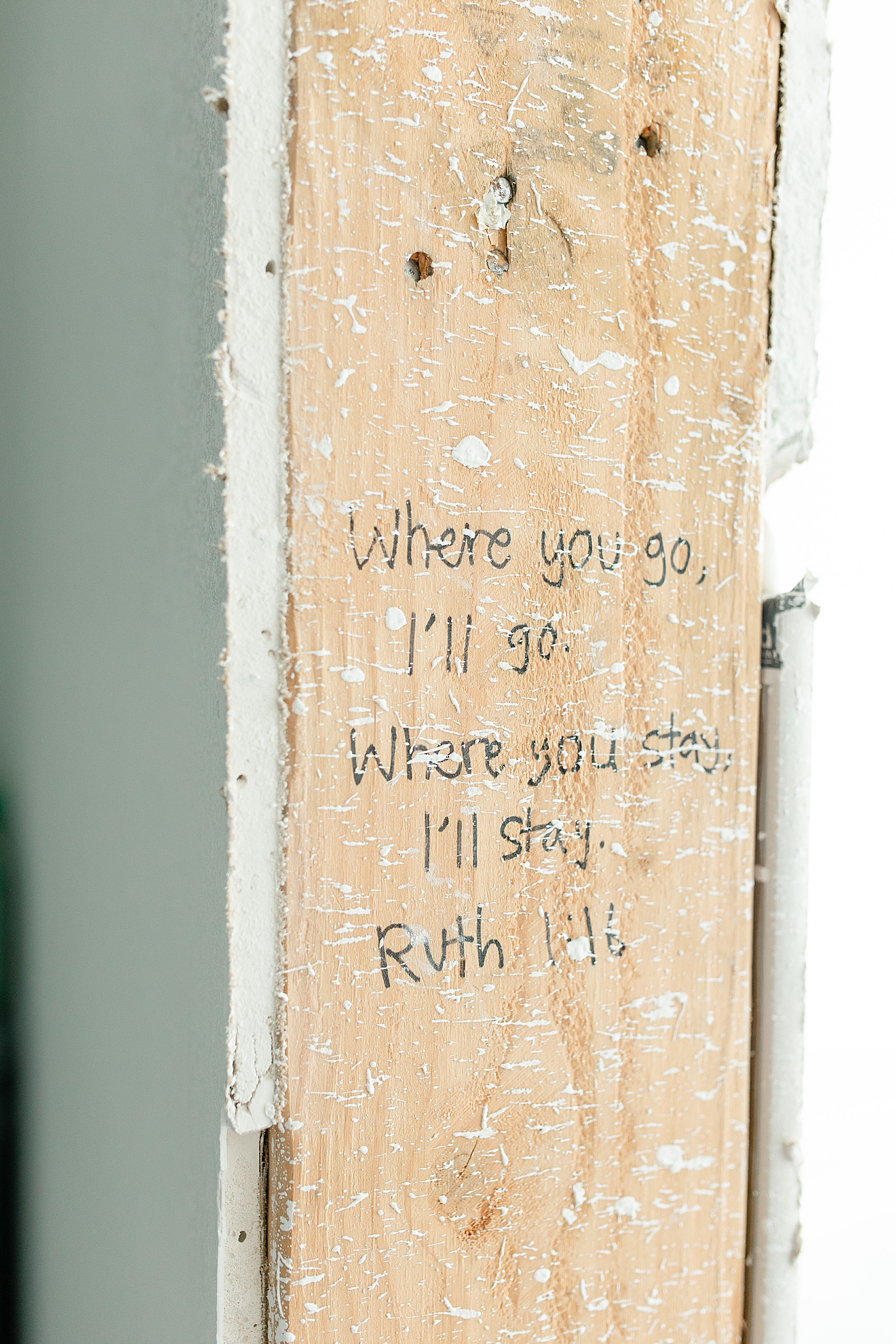 Scripture written on studs of new home being built | Photo by MS Gulf Coast Photographer Little Sunshine Photography 