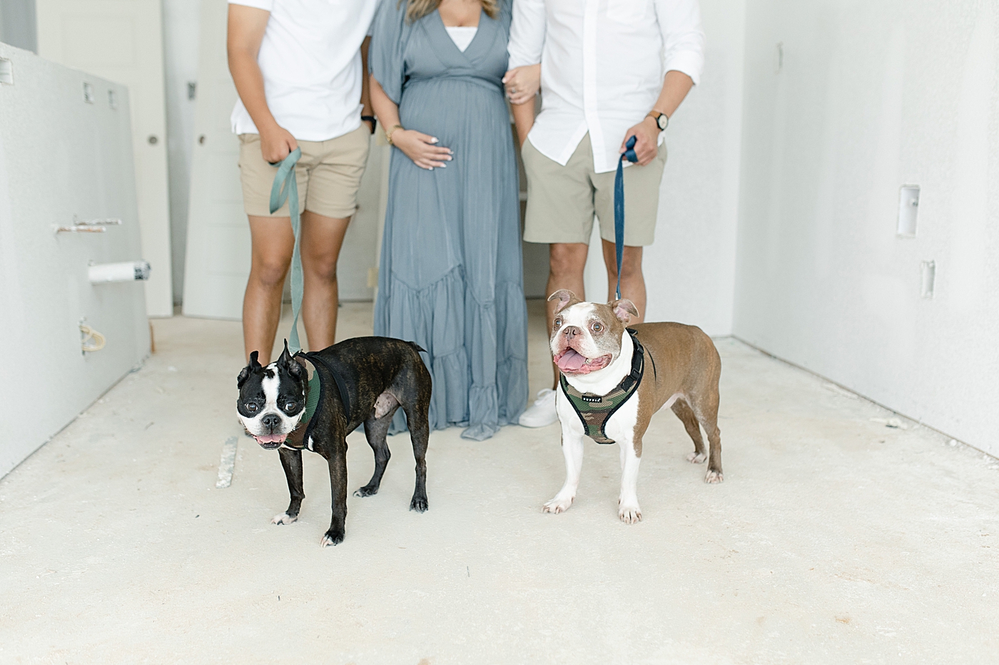 Family photos with dogs in new home construction | Photo by MS Gulf Coast Photographer Little Sunshine Photography 