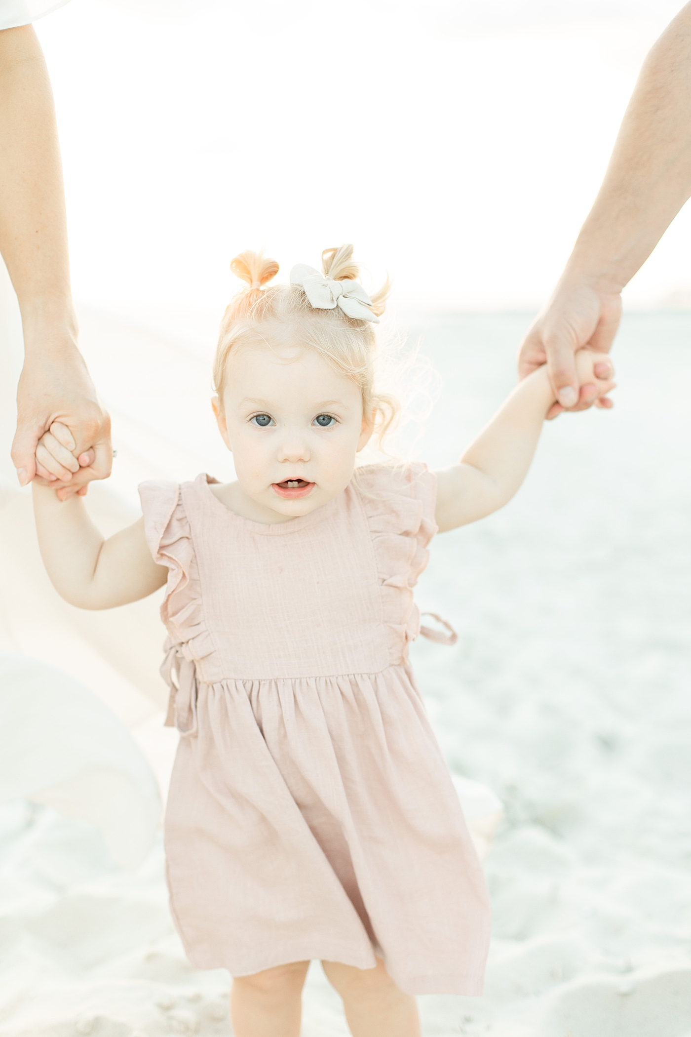 Toddler baby girl with pigtails and pink dress | Photo by Bay St. Louis MS Family Photographer Little Sunshine Photography