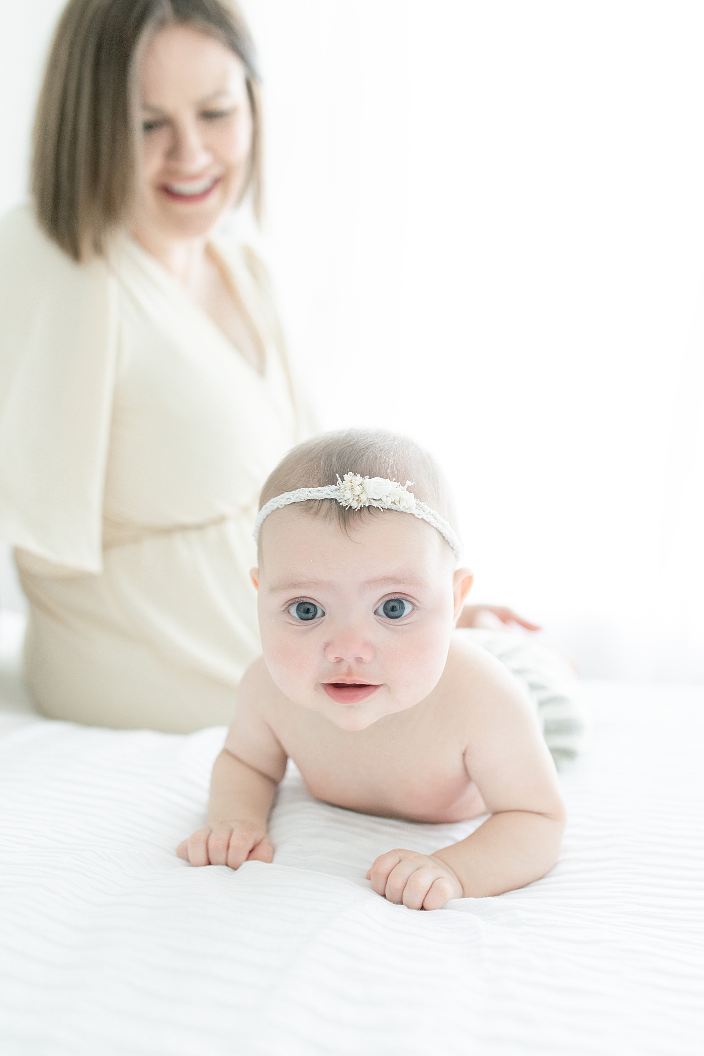 Baby girl in striped on her tummy | Photo by Hattiesburg MS Baby Photographer Little Sunshine Photography