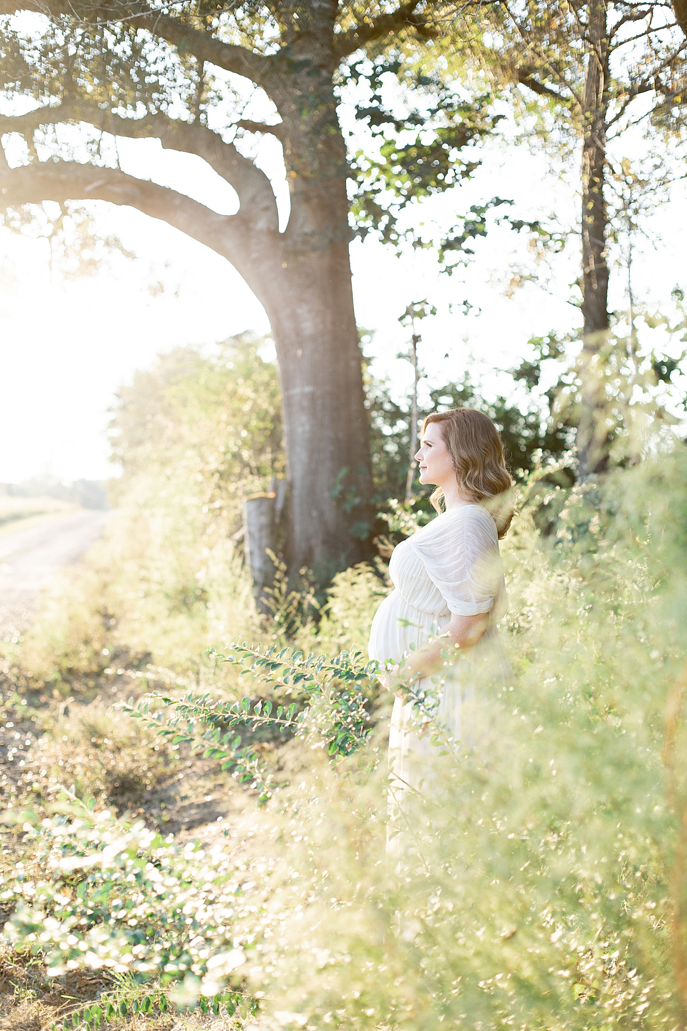 Mother to be in white dress | Photo by Little Sunshine Photography 