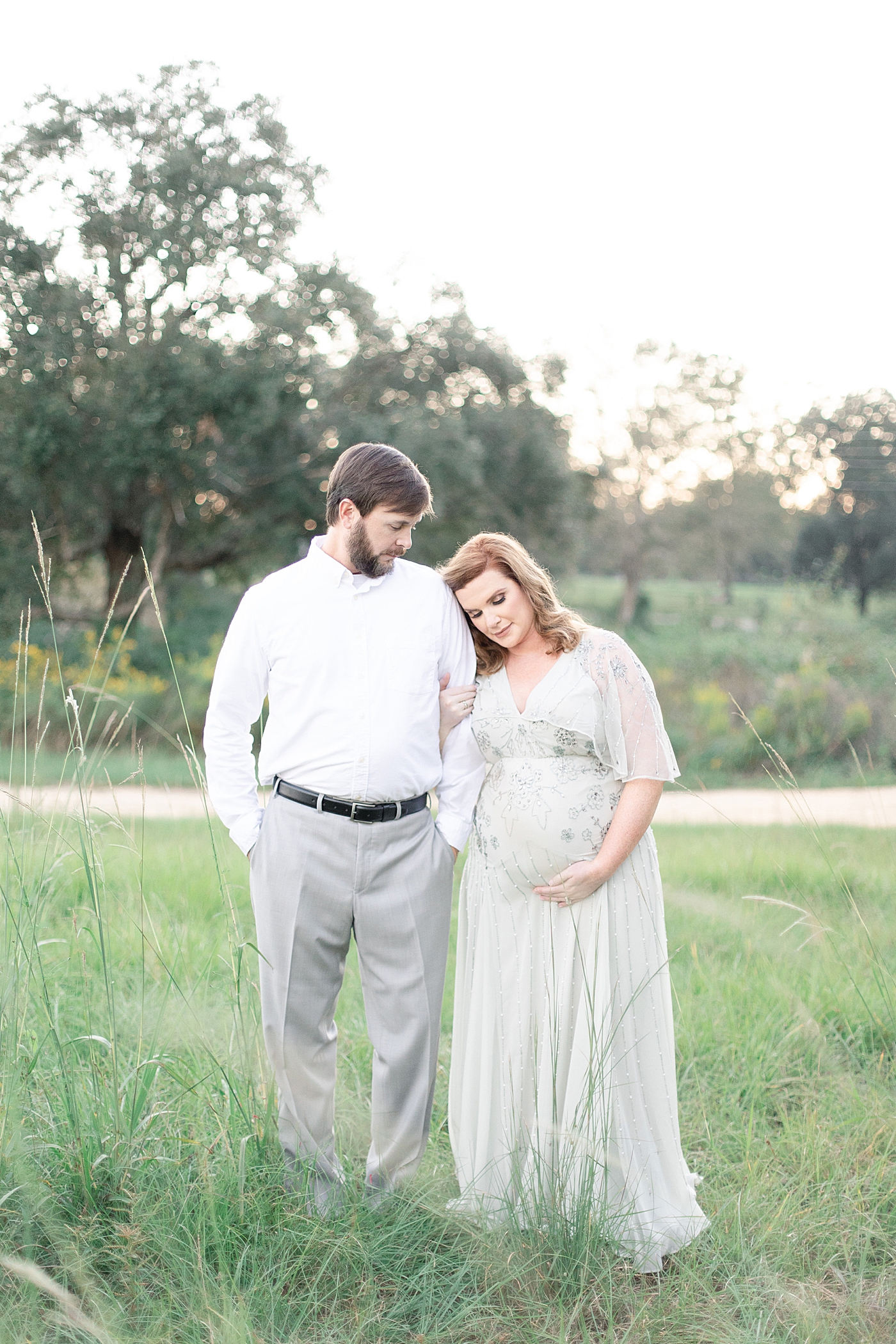 Mother and father to be interacting | Photo by Ocean Springs MS Maternity Photographer Little Sunshine Photography 