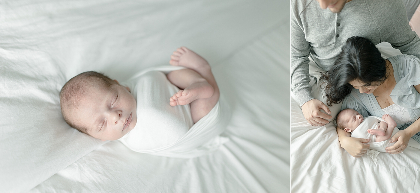 Baby boy sleeping wrapped in white swaddle | Photo by Little Sunshine Photography