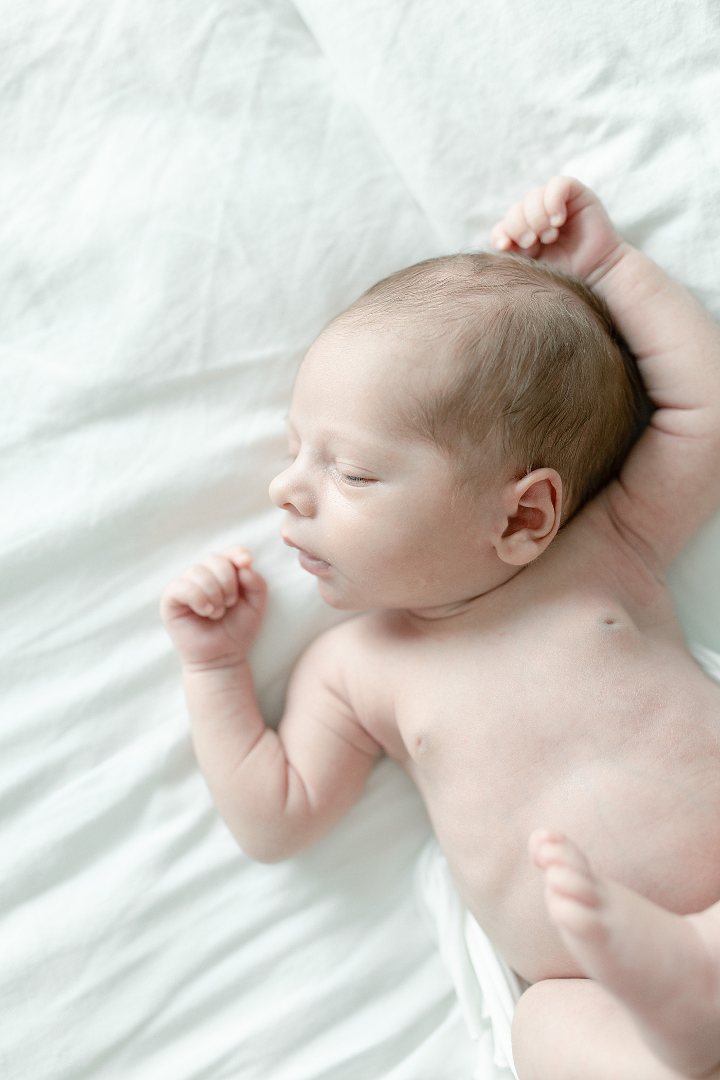 Newborn baby boy sleeping | Photo by Biloxi MS newborn photographer Little Sunshine Photography