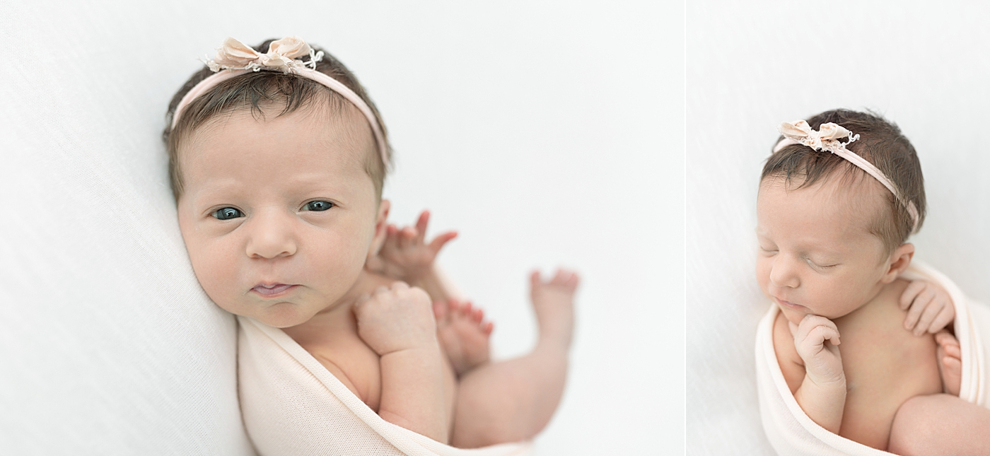 Alert newborn baby girl in blush pink swaddle and headband | Photo by Little Sunshine Photography 