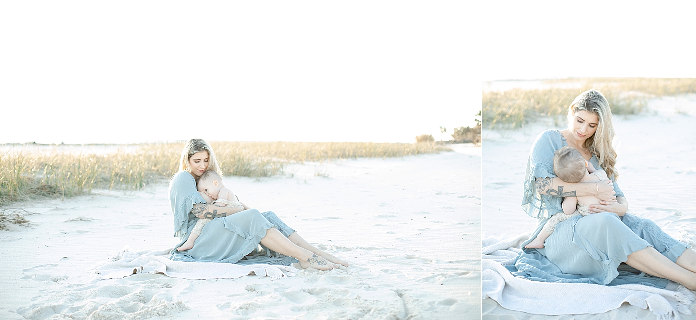 Mom in blue breastfeeding on the beach | Photo by Little Sunshine Photography