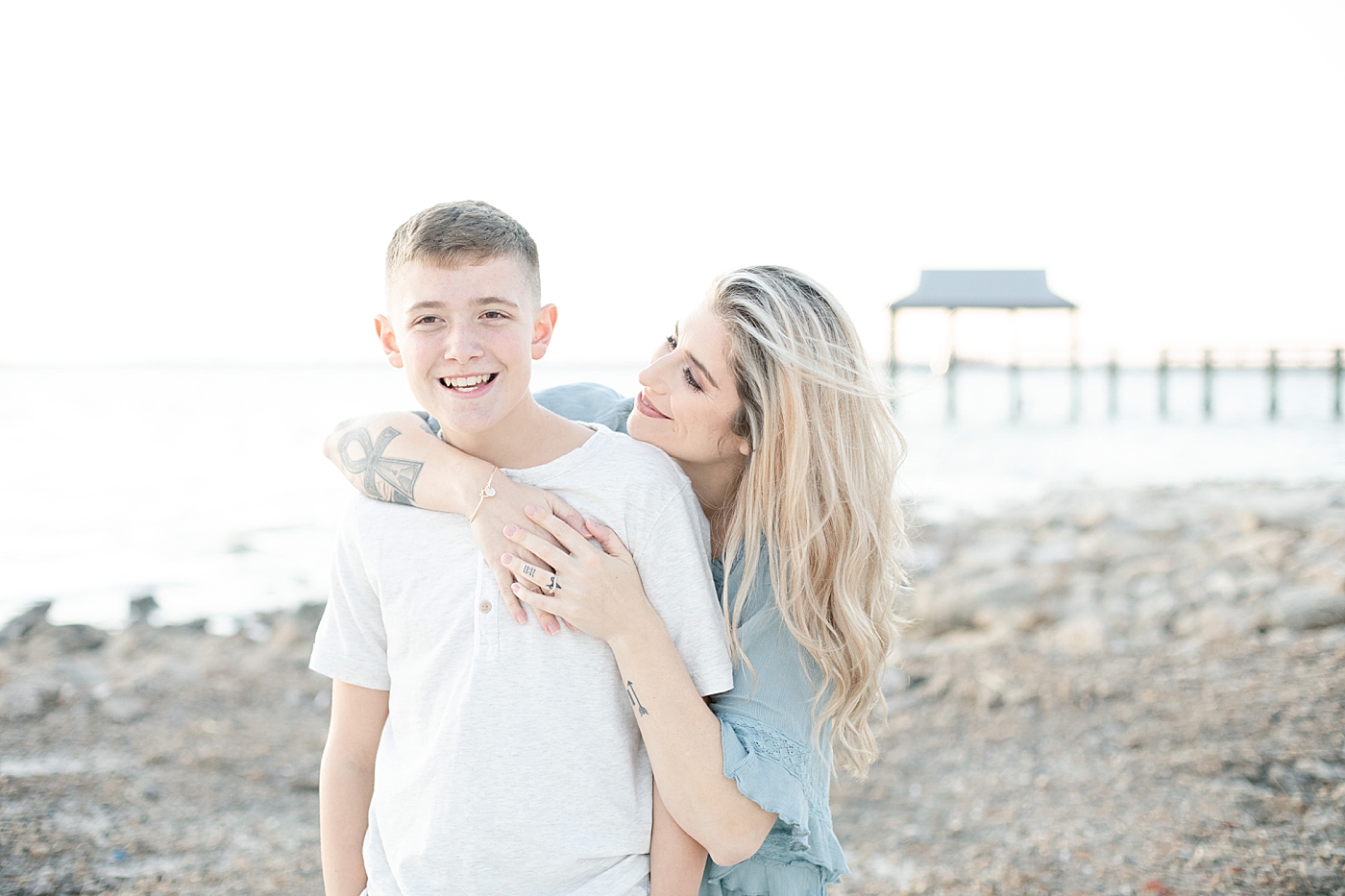 Mom giving son a hug | Photo by Ocean Springs Family Photographer Little Sunshine Photography
