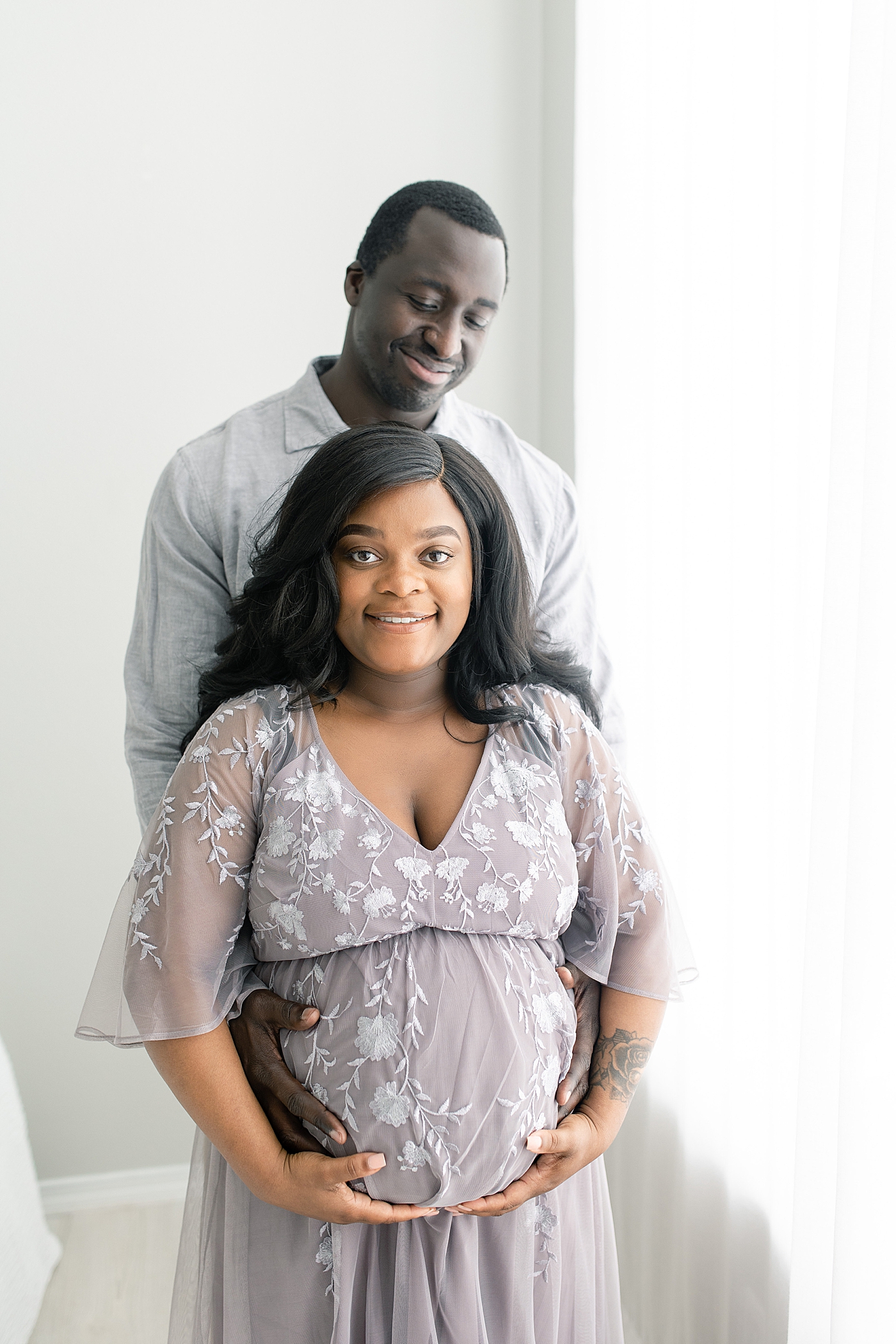 Mother and father to be smiling | Photo by Bay St. Louis Maternity Photographer Little Sunshine Photography