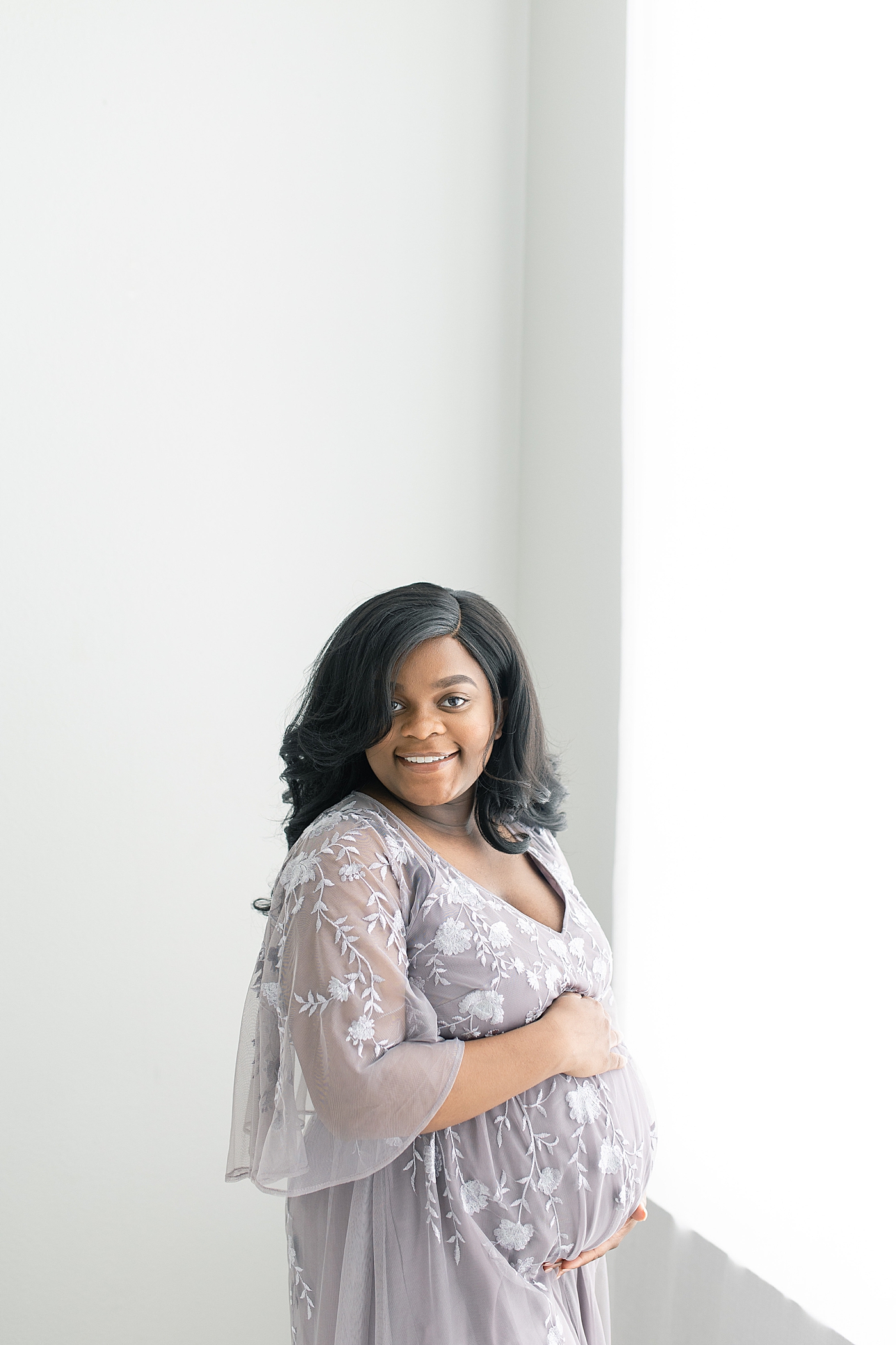 Mother to be smiling at the camera | Photo by Bay St. Louis Maternity Photographer Little Sunshine Photography