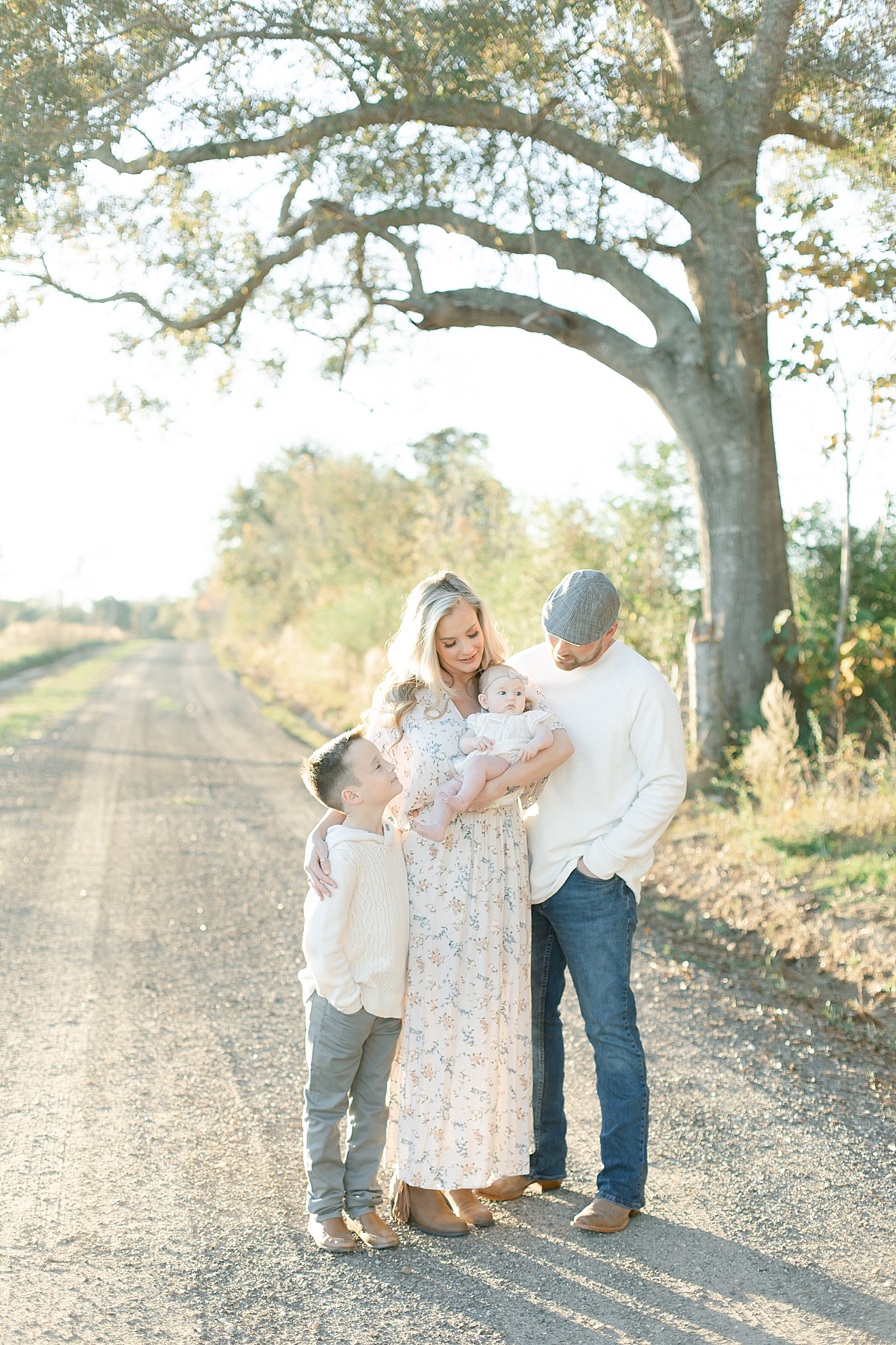 Family of four on a dirt path | Photo by Little Sunshine Photography