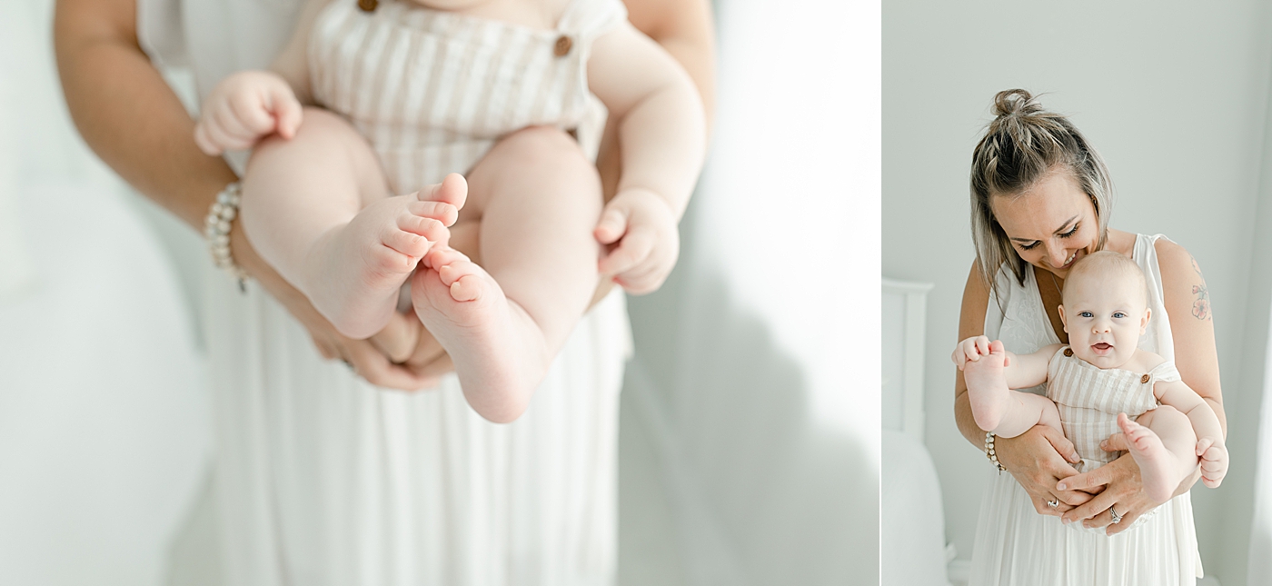 Detail of baby boy's feet held by mom | Photo by Little Sunshine Photography