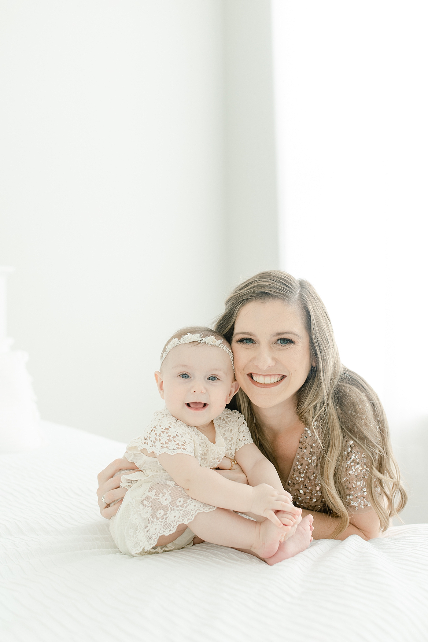 Mom and baby girl smiling during her sitter milestone session | Photo by Pass Christian baby photographer Little Sunshine Photography