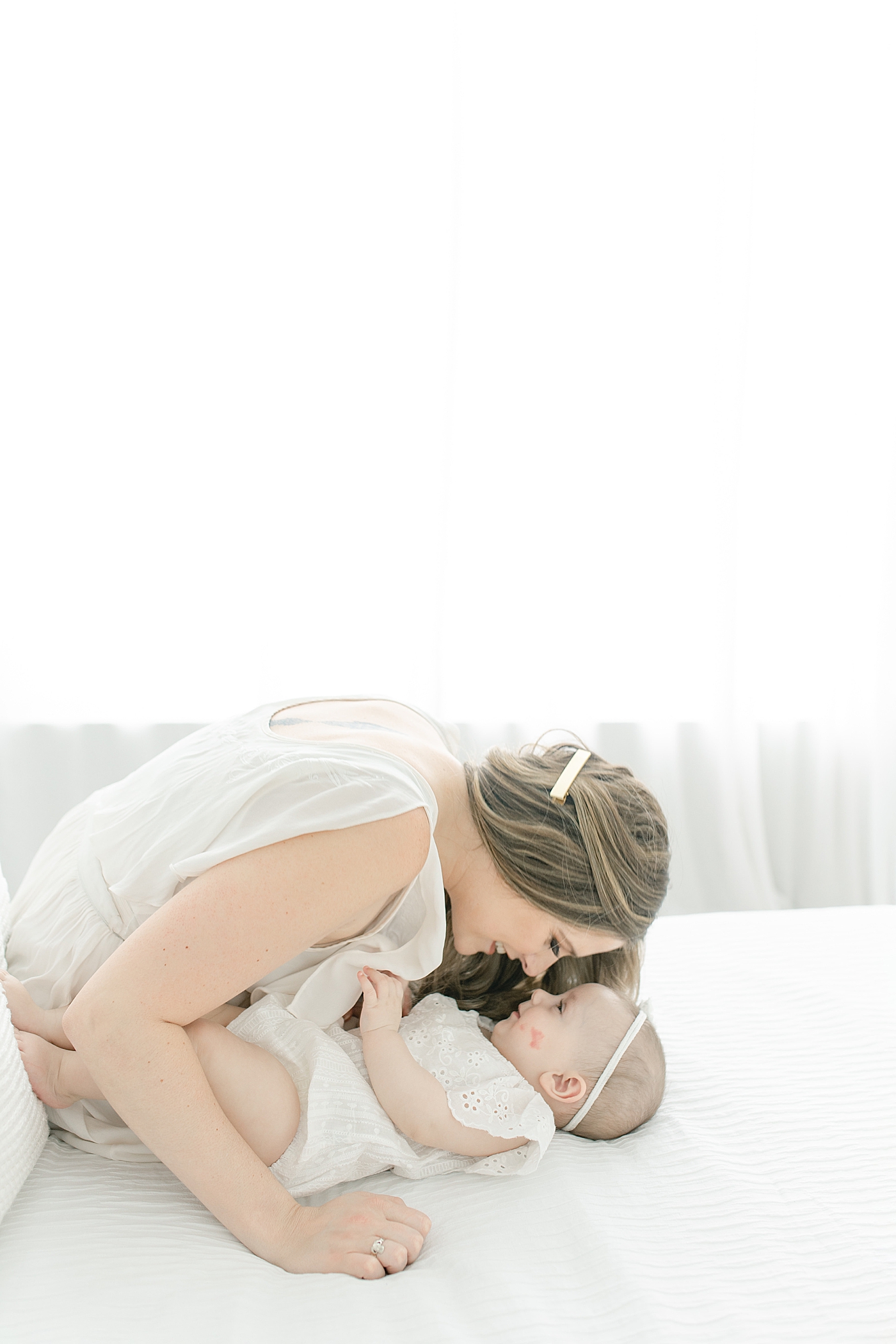 Mom and baby girl eskimo kisses | Photo by Pass Christian baby photographer Little Sunshine Photography