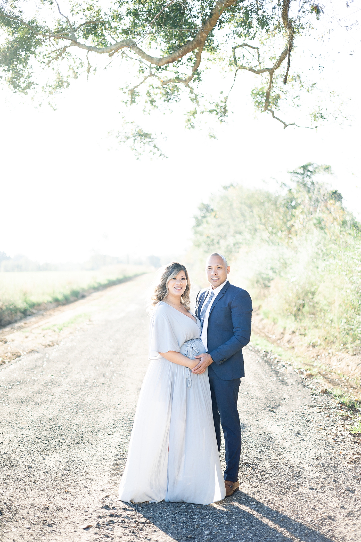 Mom and dad to be smiling together | Photo by Little Sunshine Photography 
