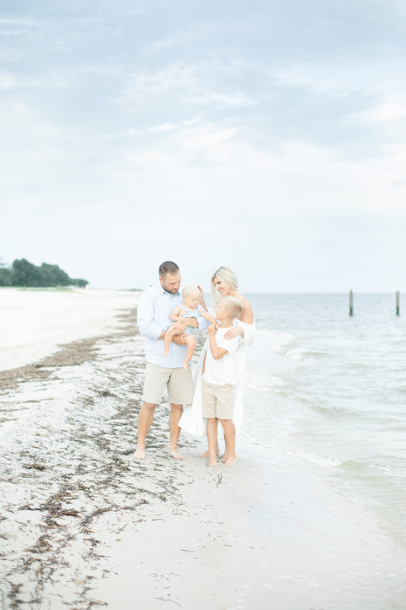 family playing near water on beach MS Gulf Coast