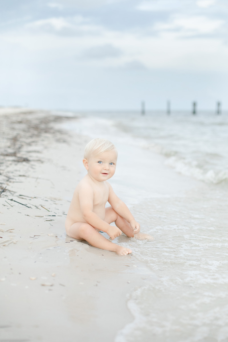baby boy playing water at beach photographer MS Gulf Coast