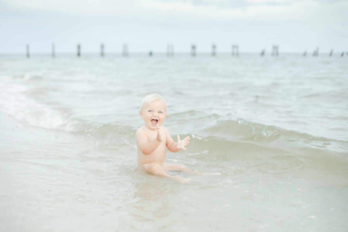 baby boy clapping in water photographer MS Gulf Coast